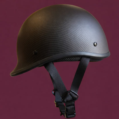 Black helmet with a textured surface on a purple background
