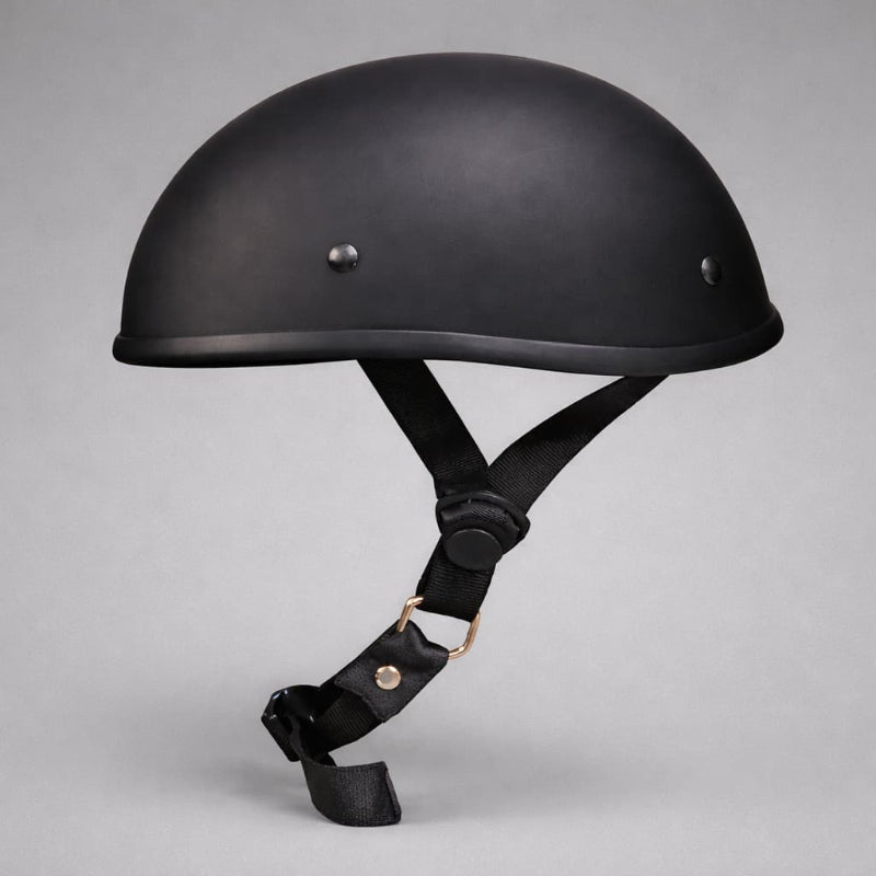 Black motorcycle helmet with chin strap on a gray background