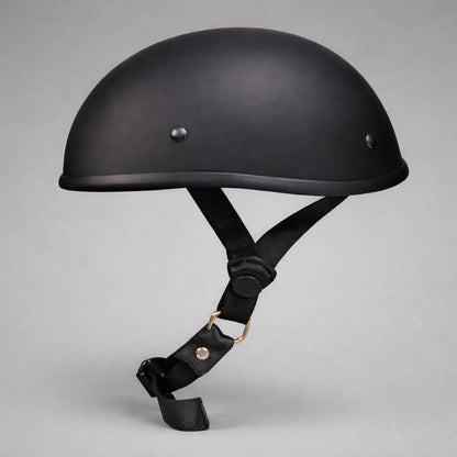 Black motorcycle helmet with chin strap on a gray background